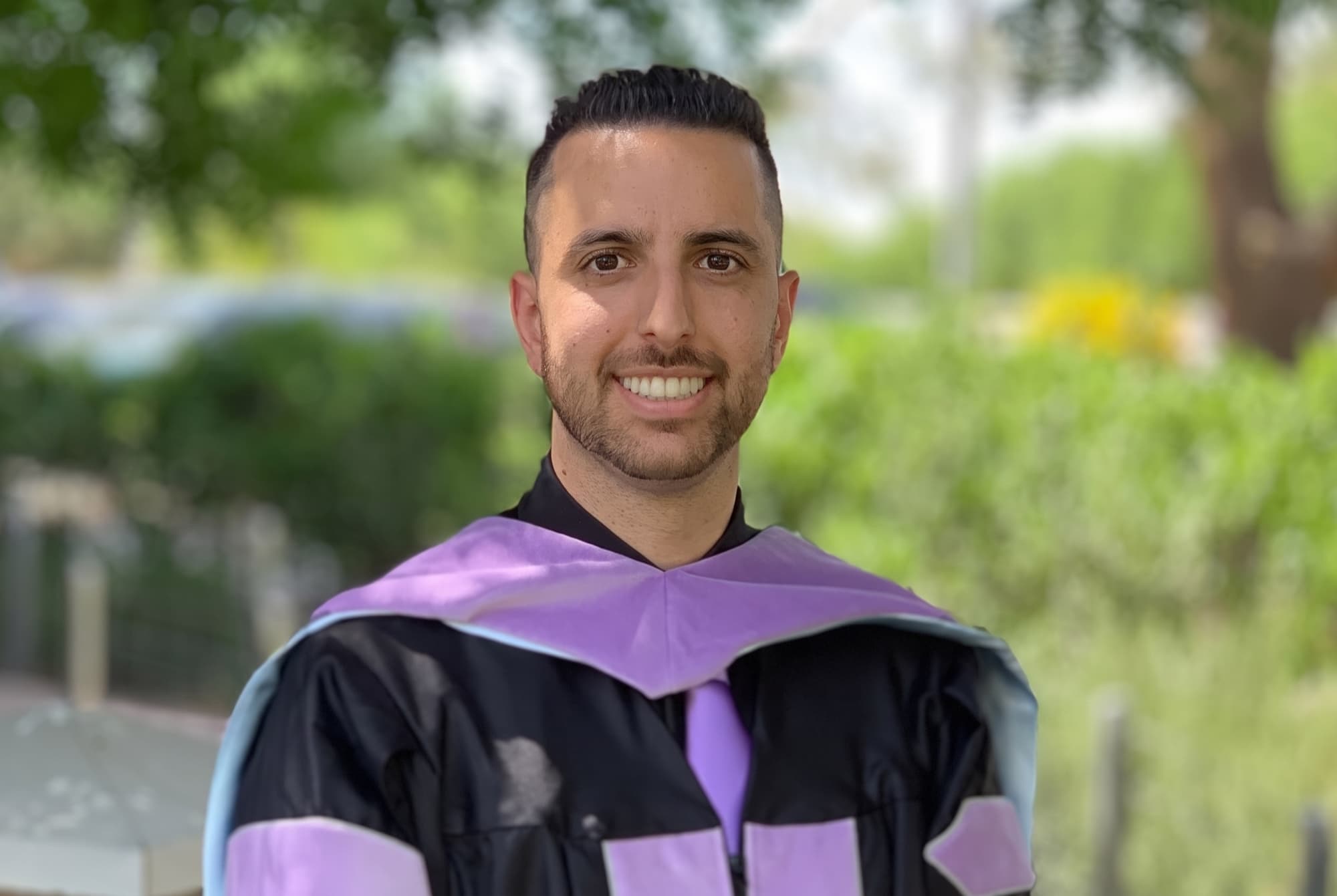 Dr. Mario Amidi in his dental school graduation gown, 2019