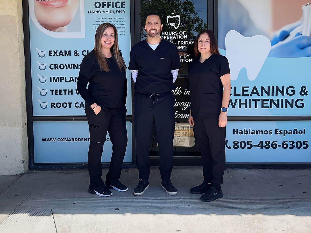 Front office manager Veronica, Dr. Mario Amidi and dental assistant Yadira outside Oxnard Dental Office on Saviers Road