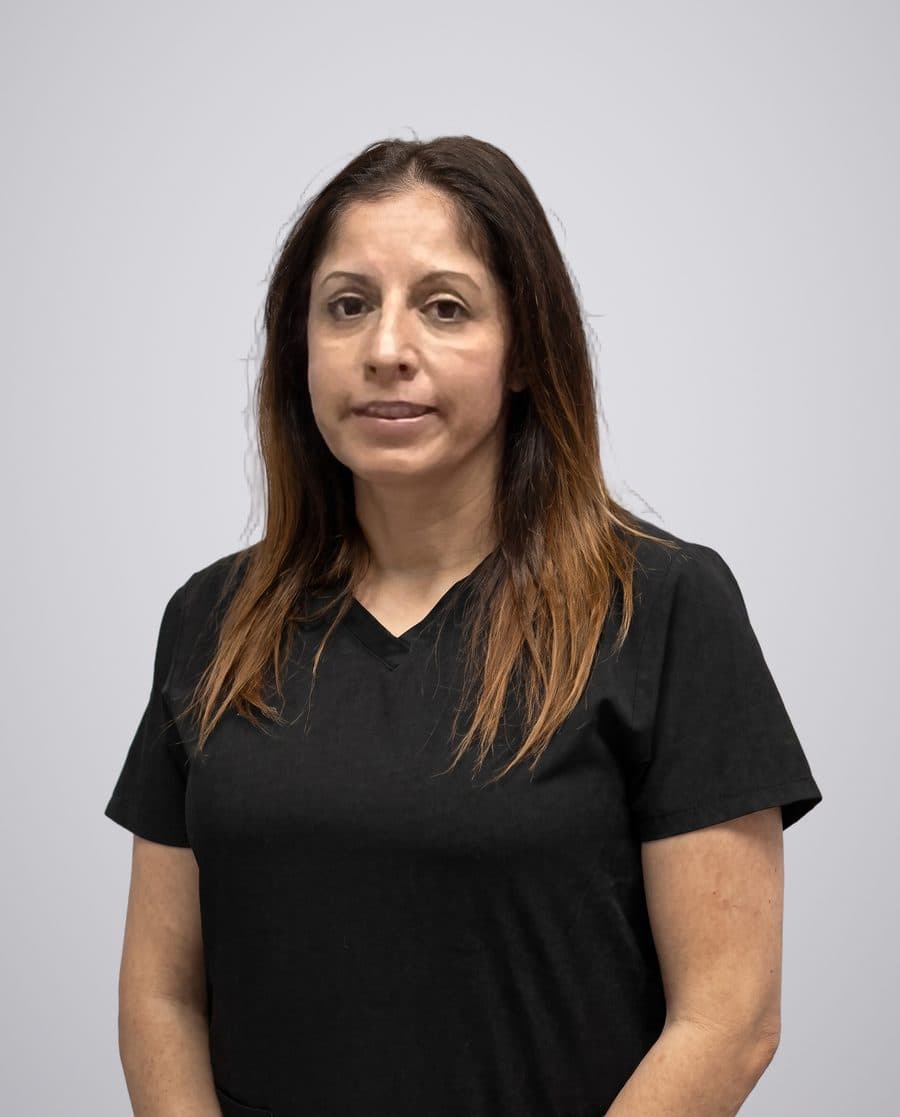 Yadira, dental assistant at Oxnard Dental Office, in black scrubs
